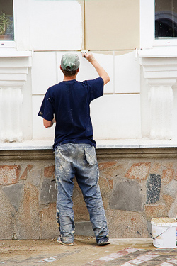 Redwood City CA handyman paints a home exterior