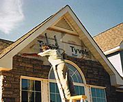 Handyman in Redwood City California fixes bricks on hosue front